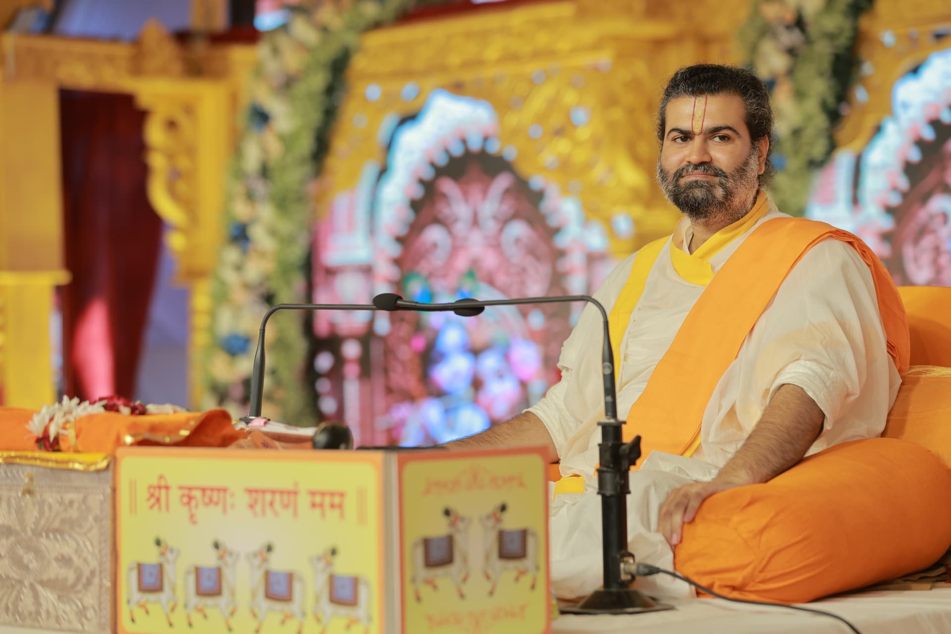 Pujya Shree Vrujrajkumar Maharaj seated during katha